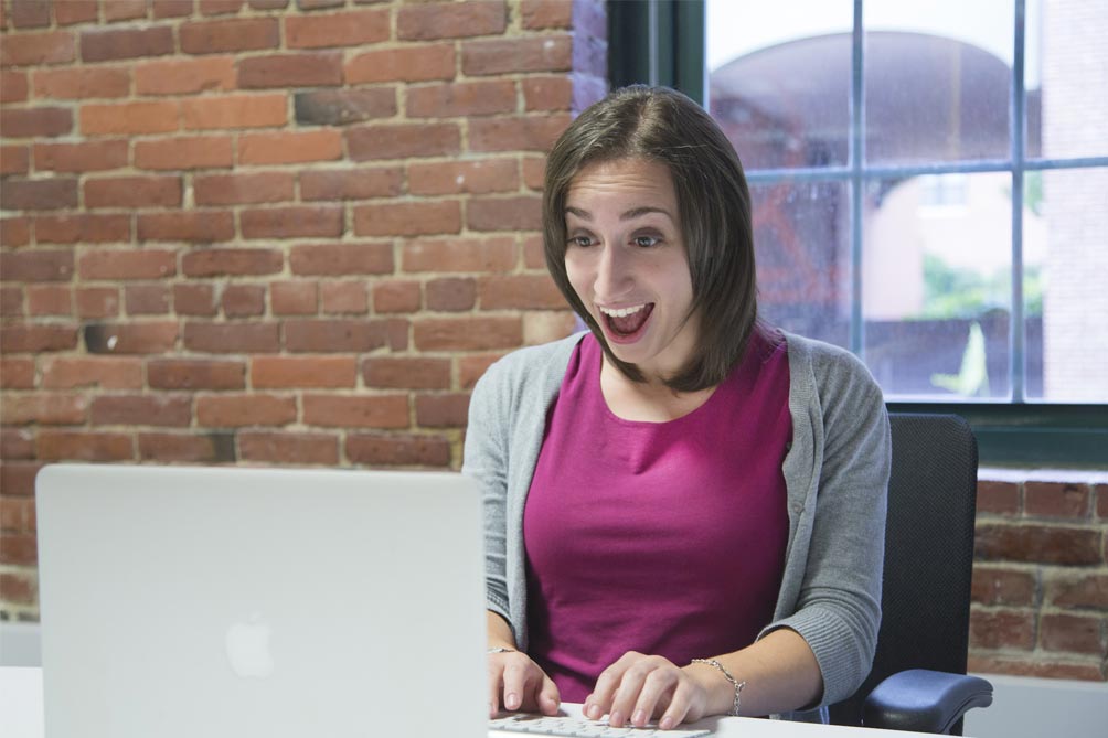 Girl-happy-with-the-laptop