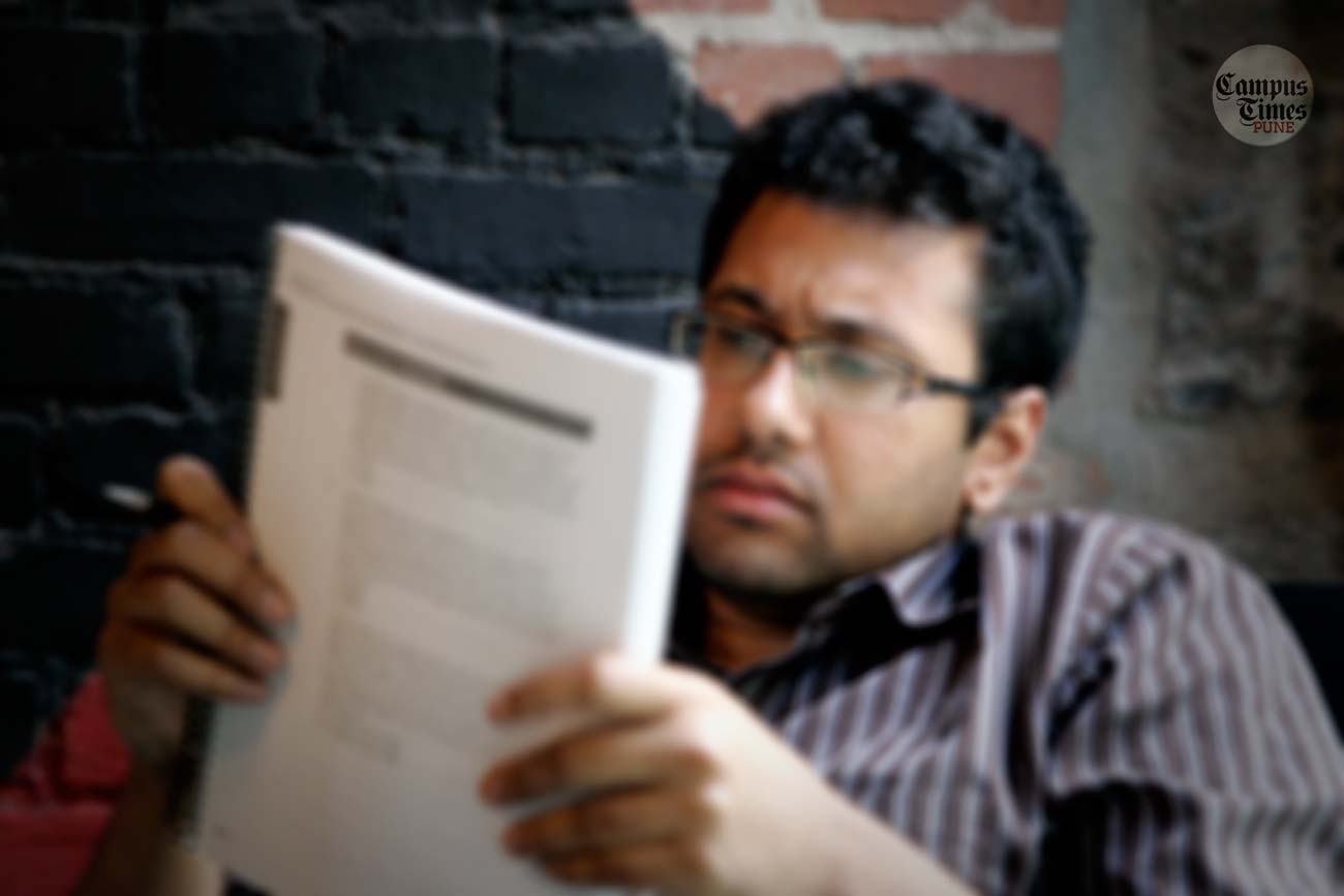 Indian-Student-reading-newspaper