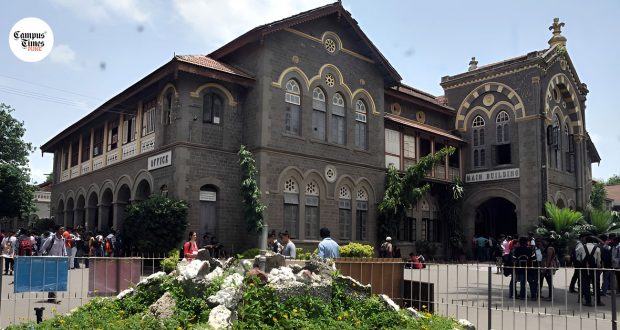 Students gathered outside a historic college main building in Pune during regular campus hours
